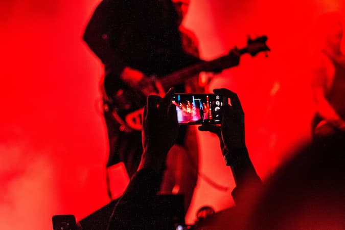 Bass player lit in red