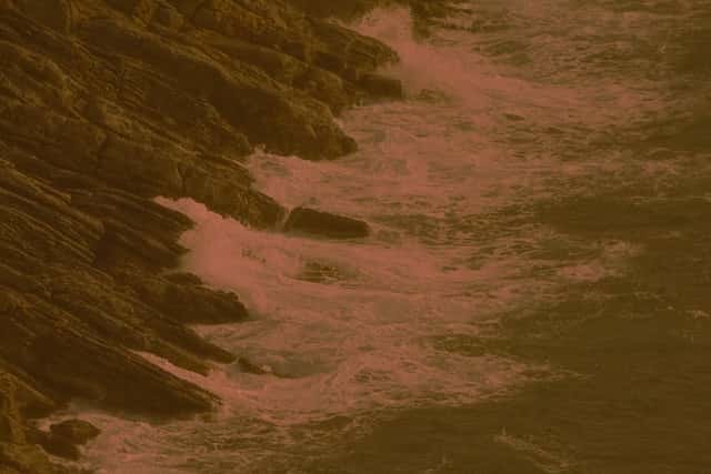 Pilgrimage album cover - waves breaking on rocks